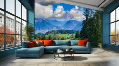 Alpine scenery with green meadows, pine forests and a deep valley. The town in the valley is Bludenz, Brandnertal, Vorarlberg, Austria
 Wall mural