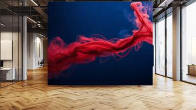 Photograph capturing the hypnotic dance of crimson smoke tendrils against a midnight blue background. Wall mural