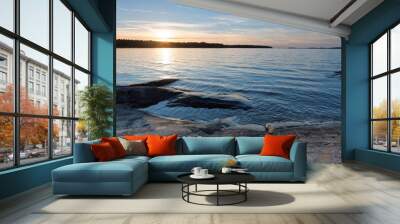 Cliffs, blue sea and horizon during sunset Wall mural