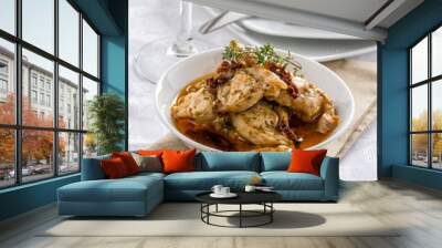 Savory rabbit dish prepared with garlic and herbs. Wall mural