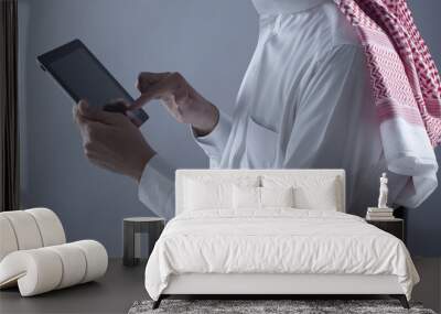 Saudi Arabian Man Hands Holding Tablet Wall mural