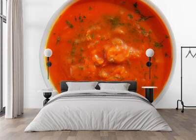 Spicy pumpkin soup in a white plate. Isolated photo. Wall mural