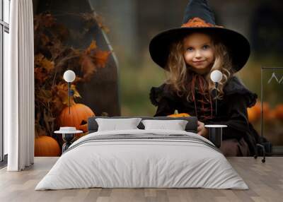 Smiling cheerful little girl in witch costume. Halloween, holiday concept Wall mural