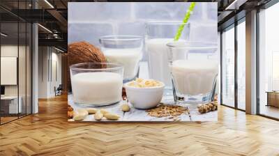 Assortment of non dairy vegan milk and ingredients Wall mural