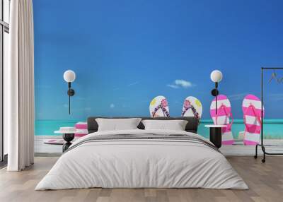 Hat, sunglasses and flip-flops on the beach of Exuma, Bahamas Wall mural