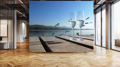 two champaign glasses against a lake Wall mural