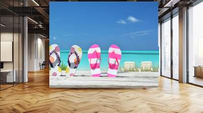 Two pairs of flip-flops against Atlantic. Exuma, Bahamas Wall mural