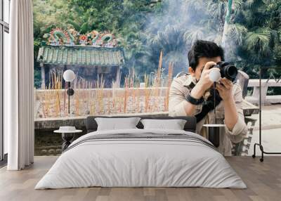 tourist taking photo in chinese temple, old film look filter effect effect Wall mural