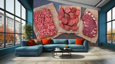 Different cuts of raw fresh angus beef meat on concrete background. Top view Wall mural