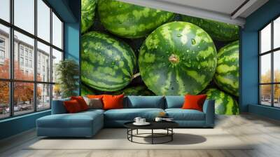 Ripe big watermelons with green striped skin on a counter of market, top view. Organic food Wall mural