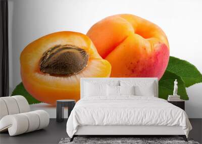 Whole and cut apricots and green leaves isolated on white background, stone fruit, fresh organic food Wall mural