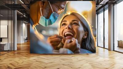 A dentist cares for the teeth of a female patient sitting in the dental chair.
 Wall mural