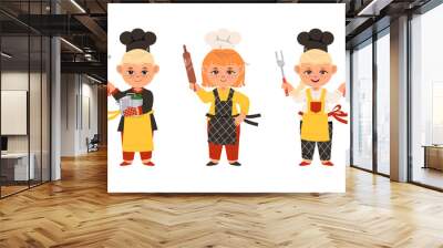 Children cook chefs in uniform with kitchen tools set cartoon vector illustration Wall mural