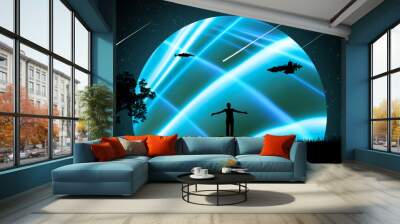 A man at night outdoors with his hands apart, raised to the air against the background of the starry sky with spaceships and a beautiful glowing neon planet. Wall mural