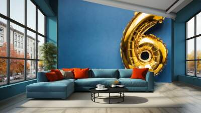 Banner with number 6 golden balloon. Six years anniversary celebration. Bright blue background. Wall mural