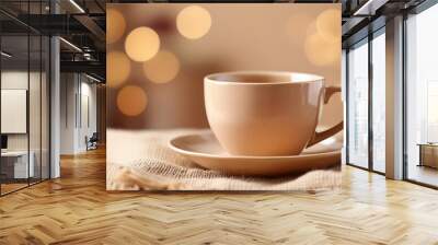 Beige ceramic cup against beige backdrop. Drink ware. Mug for hot beverage. Mock-up. Wall mural