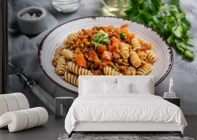 Close-up of vegan Bolognese pasta with lentils, carrots, celery. Tasty Italian food. Delicious meal. Wall mural