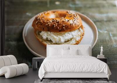 Fresh bagel with creamy cream cheese filling and sesame seeds. Tasty snack. Delicious food. Wall mural