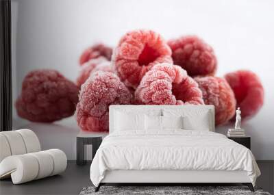 Frozen raspberries against white background. Tasty sweet berry. Organic and healthy food. Wall mural