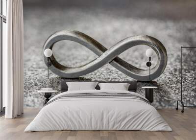 Metal infinity sign on grungy silver background. Concept of eternity, endless and unlimited. Close-up. Wall mural