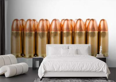 Pistol bullets standing in row. White backdrop. Shooting and firearms concept. Wall mural