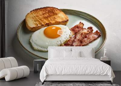 Tasty fried egg with toasted bread and bacon in plate. Delicious nutritious food, snack for lunch Wall mural