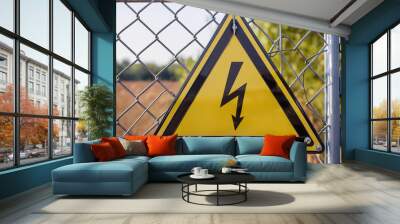 Yellow triangle warning sign with lightning bolt symbol. High voltage danger. Safety concept. Wall mural