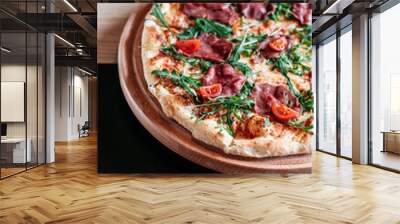 Pizza with cherry tomatoes, rucola and salami in bar environment Wall mural