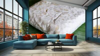 Raw tempeh on banana leaf. Tempeh is a traditional soy product originating from Indonesia. Wall mural