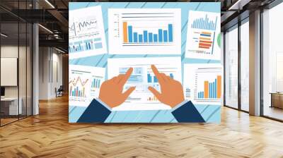 businessman analysis of business financial reports. Management of company data, metrics and marketing KPIs, financial status in beautiful graphs and reporting daily or monthly sales information simult Wall mural