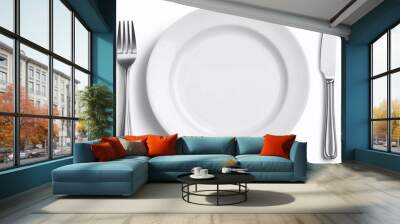 Empty white plate with spoon, knife and fork isolated on a nice white background Wall mural