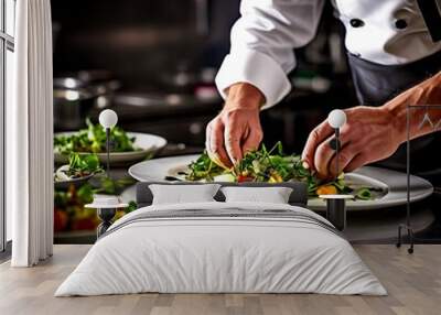 A close-up of a professional chef plating a gourmet dish in a restaurant kitchen. Wall mural