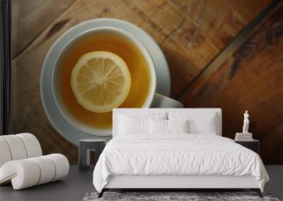 Cup of tea with lemon slice on wooden table Wall mural