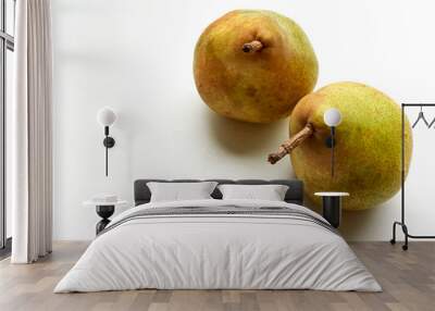 Closeup of two ripe pears on a white background with copy space. Wall mural