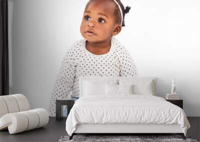 African, children and curious with a girl baby isolated on a transparent background for child development. Kids, adorable and fashion with a cute female infant sitting on PNG in a casual outfit Wall mural