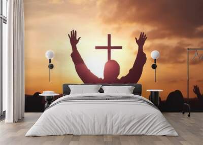 Easter and Good Friday concept,Silhouette human raising hand to praying God on blurred cross  sunset background, Generative AI Wall mural