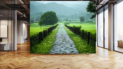 Quiet village path through green, serene fields. Wall mural