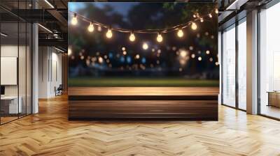 Empty Wood table top with decorative outdoor string lights hanging on tree in the garden at night time	 Wall mural