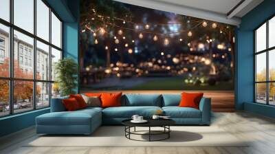 Empty Wood table top with decorative outdoor string lights hanging on tree in the garden at night time	 Wall mural