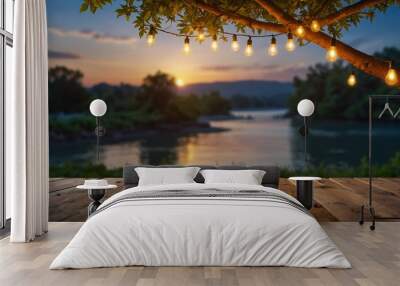 mpty Wood table top with decorative outdoor string lights hanging on tree in the garden , Daylight saving time end, real estate concept and blurred landscape of river beach Blue sky with sunset Wall mural