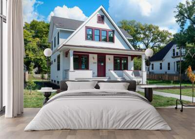 Front angled view of a newly constructed craftsman style white house with maroon accents, located in a vibrant urban neighborhood, sleek and contemporary architecture. Wall mural