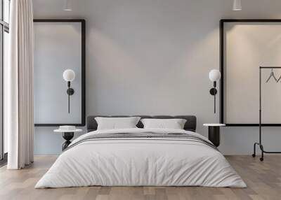 Two empty square frames on a creamy white wall, with spotlights highlighting their minimalistic beauty Wall mural