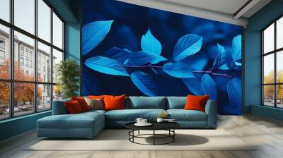 Blue plant leaves in autumn: a stunning contrast of nature’s colors Wall mural