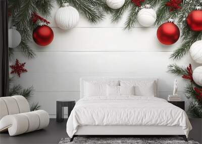 Festive christmas arrangement with fir branches and red and white baubles on white wooden background - perfect noel banner for holiday websites Wall mural