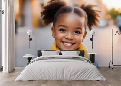 Portrait of happy african american girl looking at camera Wall mural