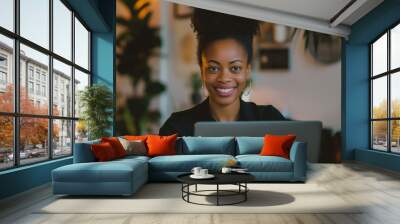 a smiling businesswoman working on a laptop in a clean, minimalistic office, soft lighting Wall mural