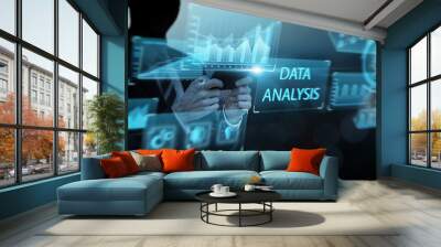 Businessman using mobile phone analyzing data growth increasing sales, marketing, development, management, ideas innovation planning strategy, futuristic icon hologram blue background Wall mural