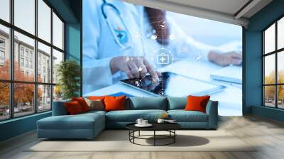 Medicine doctor or medical students with stethoscope using digital tablet laptop,Health Check with digital system support for patient with medical icon at hospital, Medical network technology concept. Wall mural