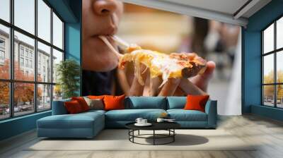 women eating pizza.she is having party at home Wall mural