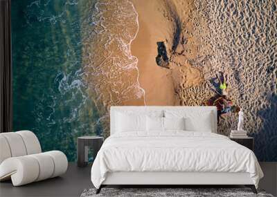 Beautiful beach with family top view shot Wall mural